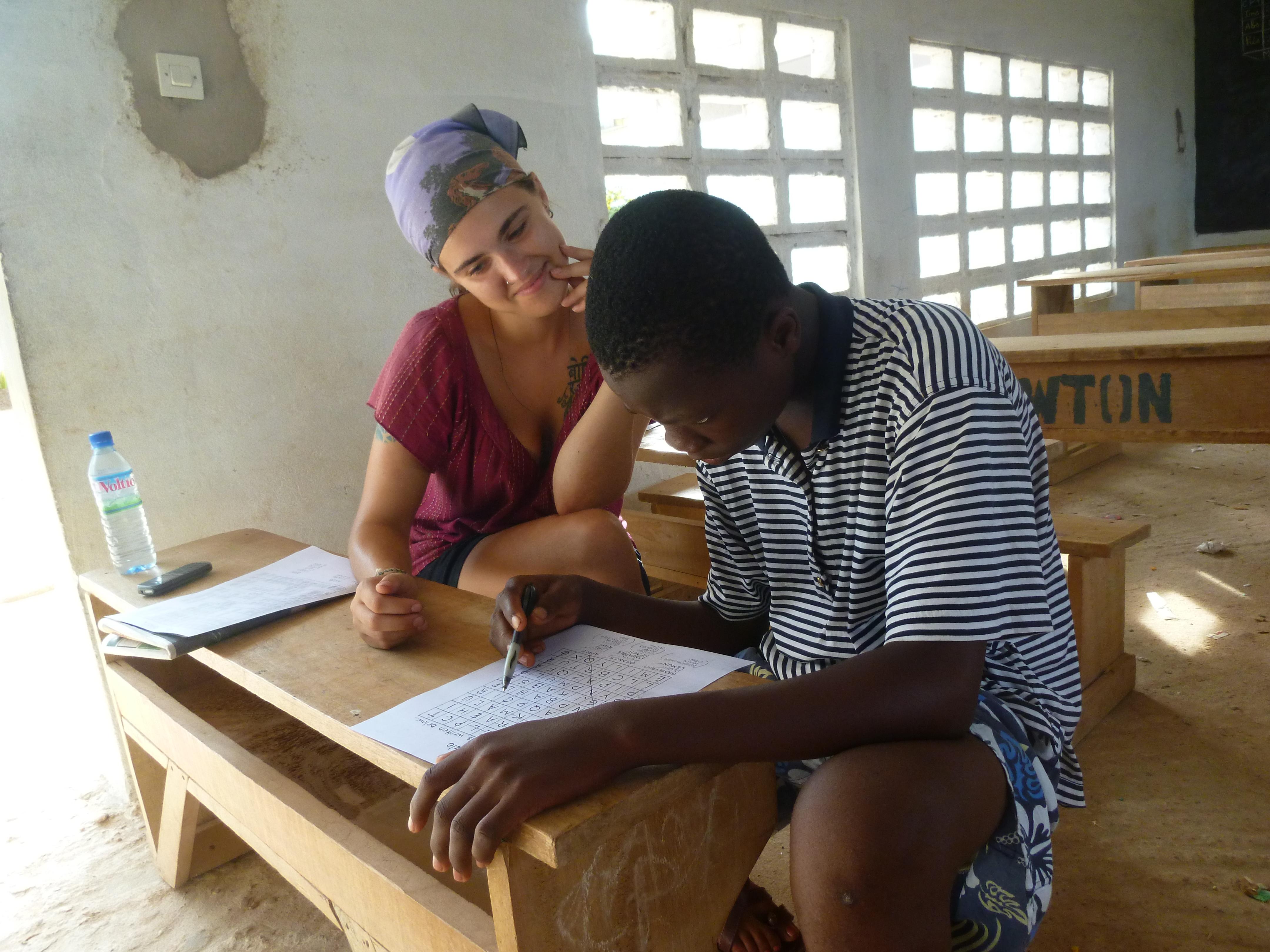 A Speech Therapy intern works with a student in a classroom at a school in Africa. A young man participates in a therapy session run by a student doing a Speech Therapy internship in Africa.